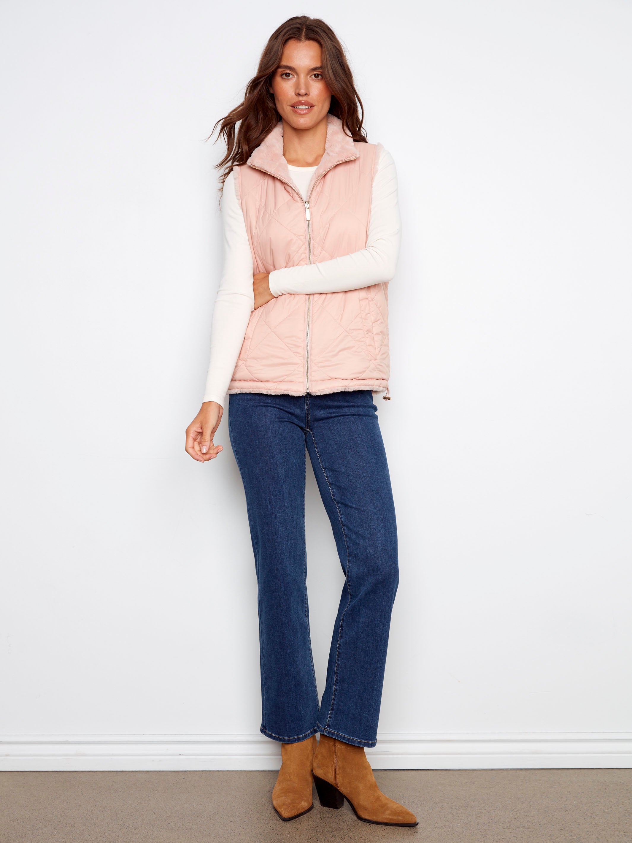 Chic ballet pink vest with quilted and faux fur reversible design for versatile styling by Charlie B.