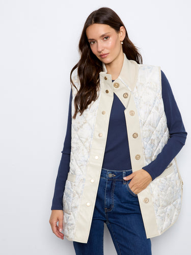 Reversible design vest offers versatility and style in one piece, ideal for any season. By Charlie B.