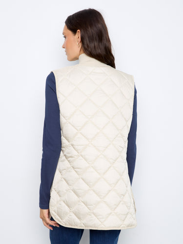 This chic quilted vest is designed with a reversible feature for versatile styling options. By Charlie B.