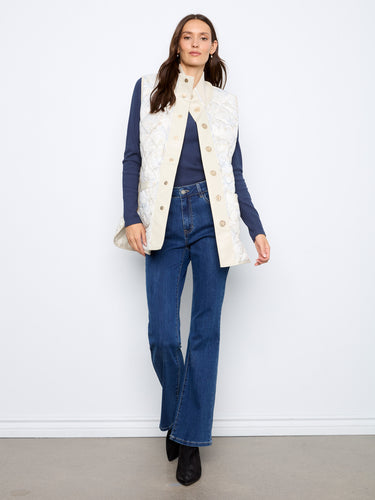 Snap-button closure on the front adds ease and charm to this elegant quilted sleeveless design. By Charlie B.