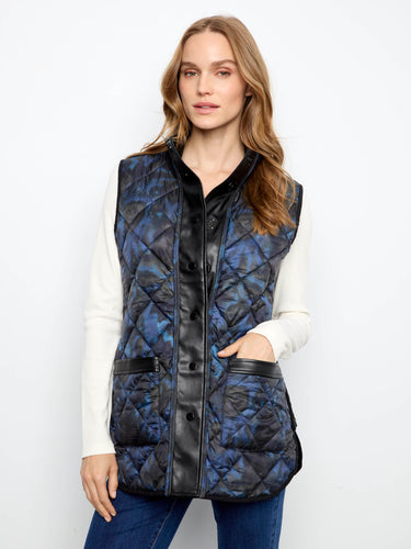Vest with side zipper details adds a contemporary edge to the classic quilted design. By Charlie B.