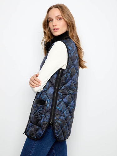Sleeveless quilted vest, ideal for layering over long sleeves in transitional weather. By Charlie B.