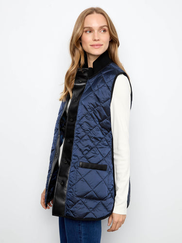 Snap-button closure on this chic quilted vest provides easy wearability and style. By Charlie B.