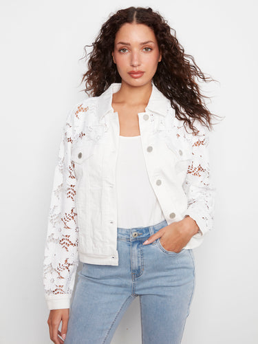 Chic white jacket with exquisite floral embroidery and convenient welt pockets for added style by Charlie B.