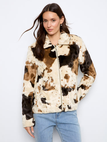Faux fur jacket in cow print featuring welt pockets for added functionality and style by Charlie B.