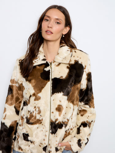 Stylish cow print faux fur jacket with zip-front closure, ideal for adding flair to any ensemble by Charlie B.