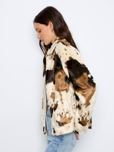 This cow print faux fur jacket features a trendy shirt collar, blending fashion with comfort effortlessly by Charlie B.