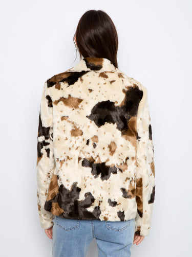 Welt pockets enhance the practicality of this chic cow print faux fur jacket by Charlie B.