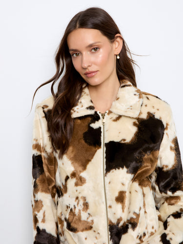 Soft and luxurious, this cow print faux fur jacket is perfect for staying warm in style by Charlie B.