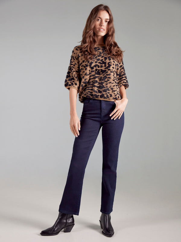 Fashion-forward leopard print top with plush knit material offering comfort and style by Charlie B.