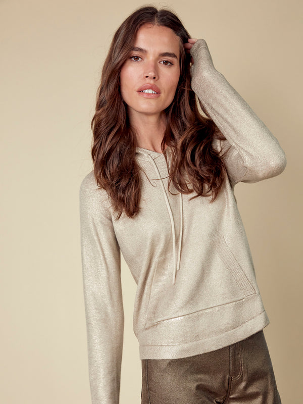 The shimmering finish on this champagne hoodie elevates its classic silhouette with modern flair by Charlie B.