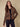 Fashionable brown and black cardigan designed with long sleeves and plushy texture by Charlie B.