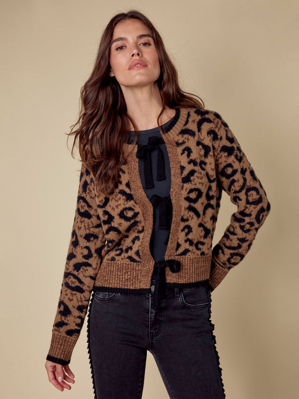 Fashionable brown and black cardigan designed with long sleeves and plushy texture by Charlie B.