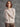 Sophisticated oat-colored sweater with charming white floral embroidery on the shoulders by Charlie B.