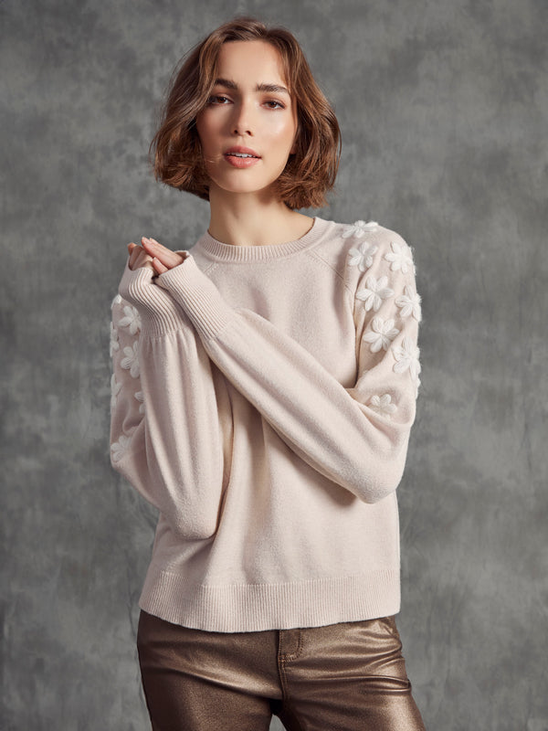Sophisticated oat-colored sweater with charming white floral embroidery on the shoulders by Charlie B.