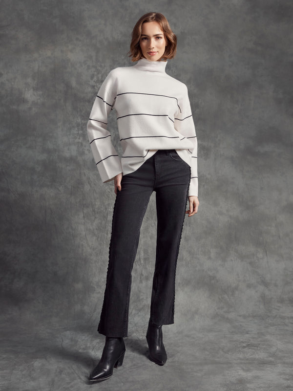 Sophisticated ecru piece with long sleeves and subtle stripe detail by Charlie B.