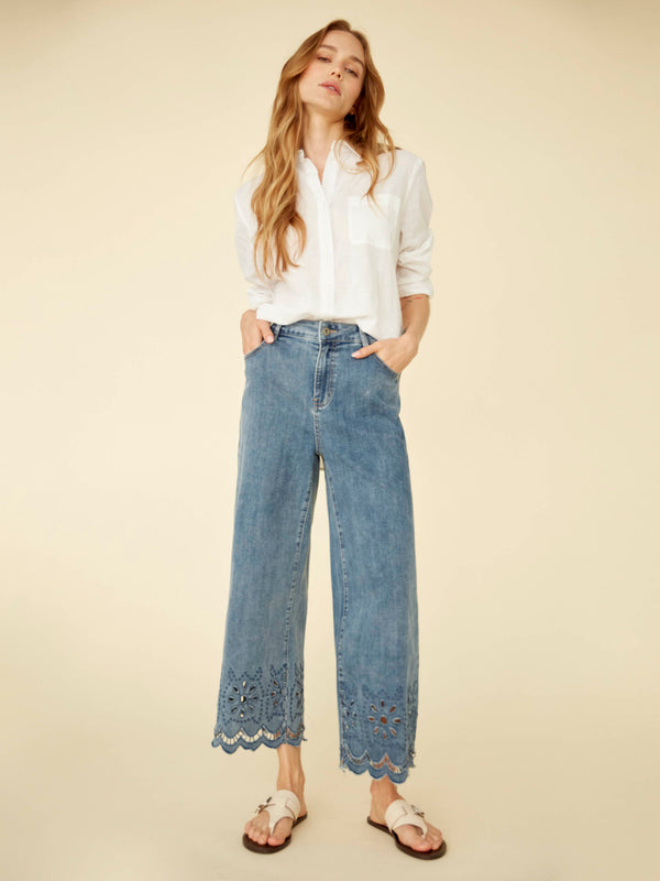 Showcasing a wide leg design in stretch denim, these pants are elevated with a detailed scalloped eyelet hem by Charlie B.