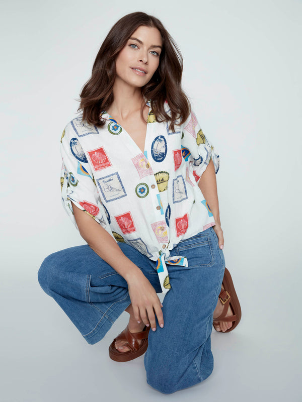 Casual blouse in postcard print featuring a delightful button-up style and charming front tie detail by Charlie B.