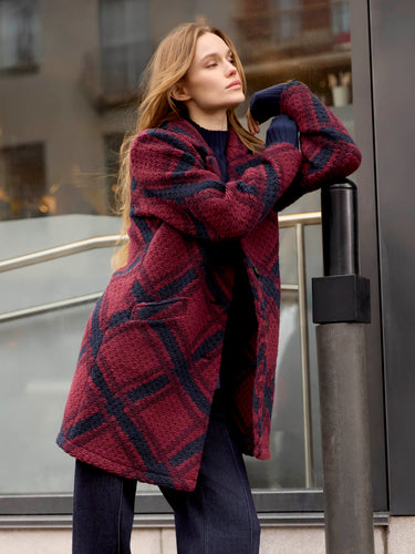 Cozy plaid coat with a unique design, adding flair to any outfit effortlessly. By Charlie B.