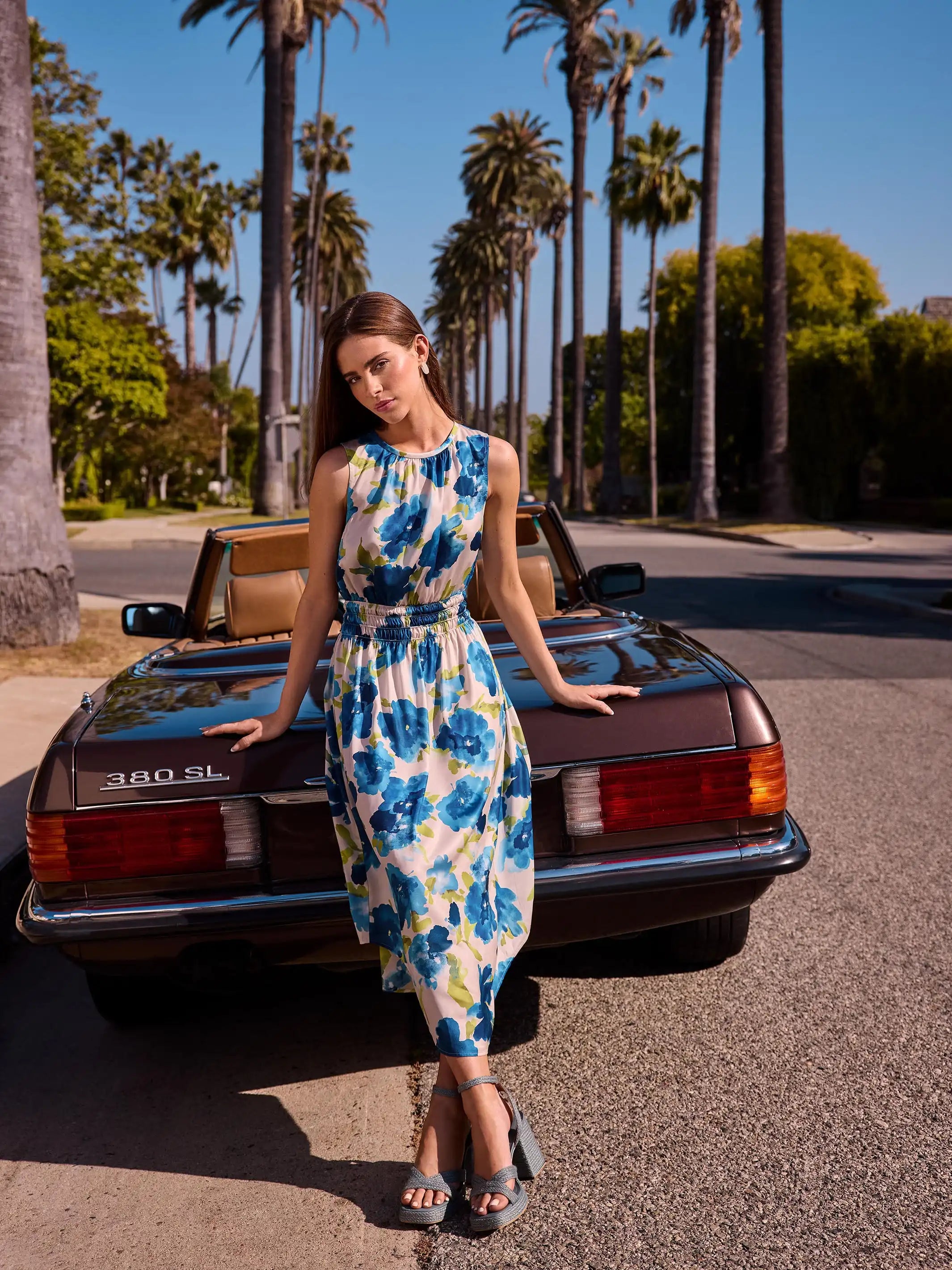 Elegant sleeveless design on a flowy floral midi dress by Charlie B.