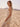 Chic sleeveless design in a natural color palette by Charlie B.