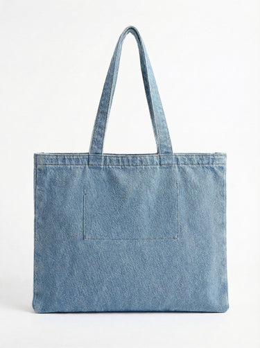 Made from durable 100% cotton, this denim tote bag features an embossed logo and practical dimensions of 16" x 12.75" x 3" by Charlie B.
