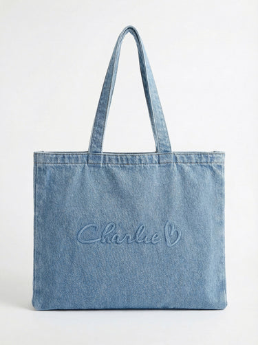 Denim tote bag with comfortable carry handles and a generous handle height of 10 inches. Embossed with the signature logo by Charlie B.