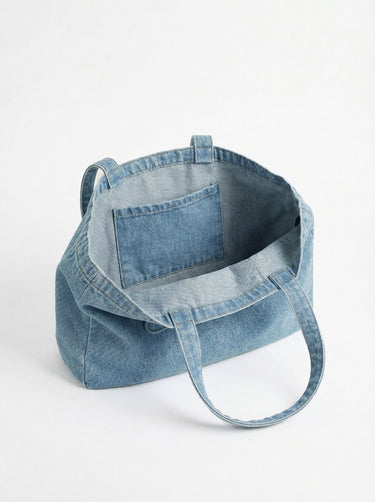 Denim tote bag crafted from 100% cotton, showcasing the embossed Charlie B logo. Features carry handles for easy portability by Charlie B.