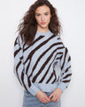 Cozy sweater with a classic crew neck and striking zebra pattern, perfect for casual days. By Charlie B.