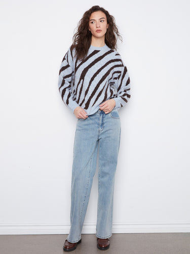 Stylish drop shoulders add a modern touch to this relaxed fit sweater with bold stripes. By Charlie B.