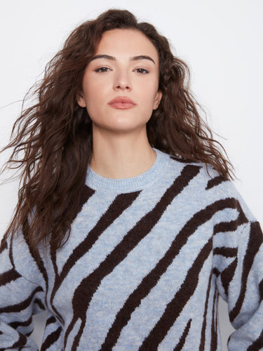 Long sleeves provide warmth while maintaining a chic look in this patterned pullover. By Charlie B.