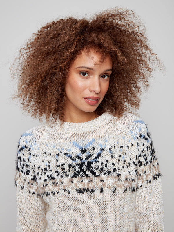 Elegant ecru sweater highlighting the geometric design in plush knit fabric by Charlie B.