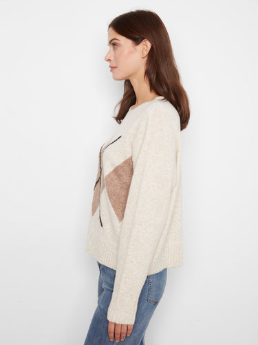 Stylish argyle pattern on this sweater adds a unique touch to your wardrobe essentials. By Charlie B.