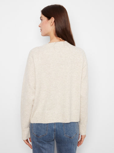 The whipstitch detail on this sweater provides an artisanal finish that stands out beautifully. By Charlie B.
