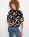 This stylish sweater features a mock neck design, adding a touch of elegance to your casual wardrobe. By Charlie B.