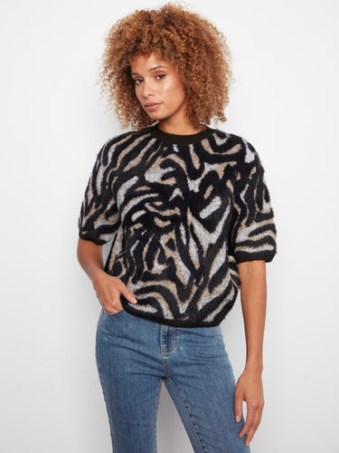This stylish sweater features a mock neck design, adding a touch of elegance to your casual wardrobe. By Charlie B.