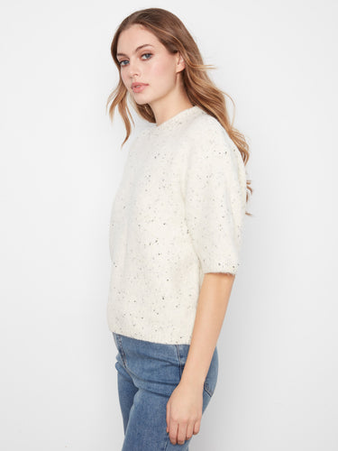 Speckled knit sweater showcasing balloon elbow sleeves and a comfortable fit by Charlie B.
