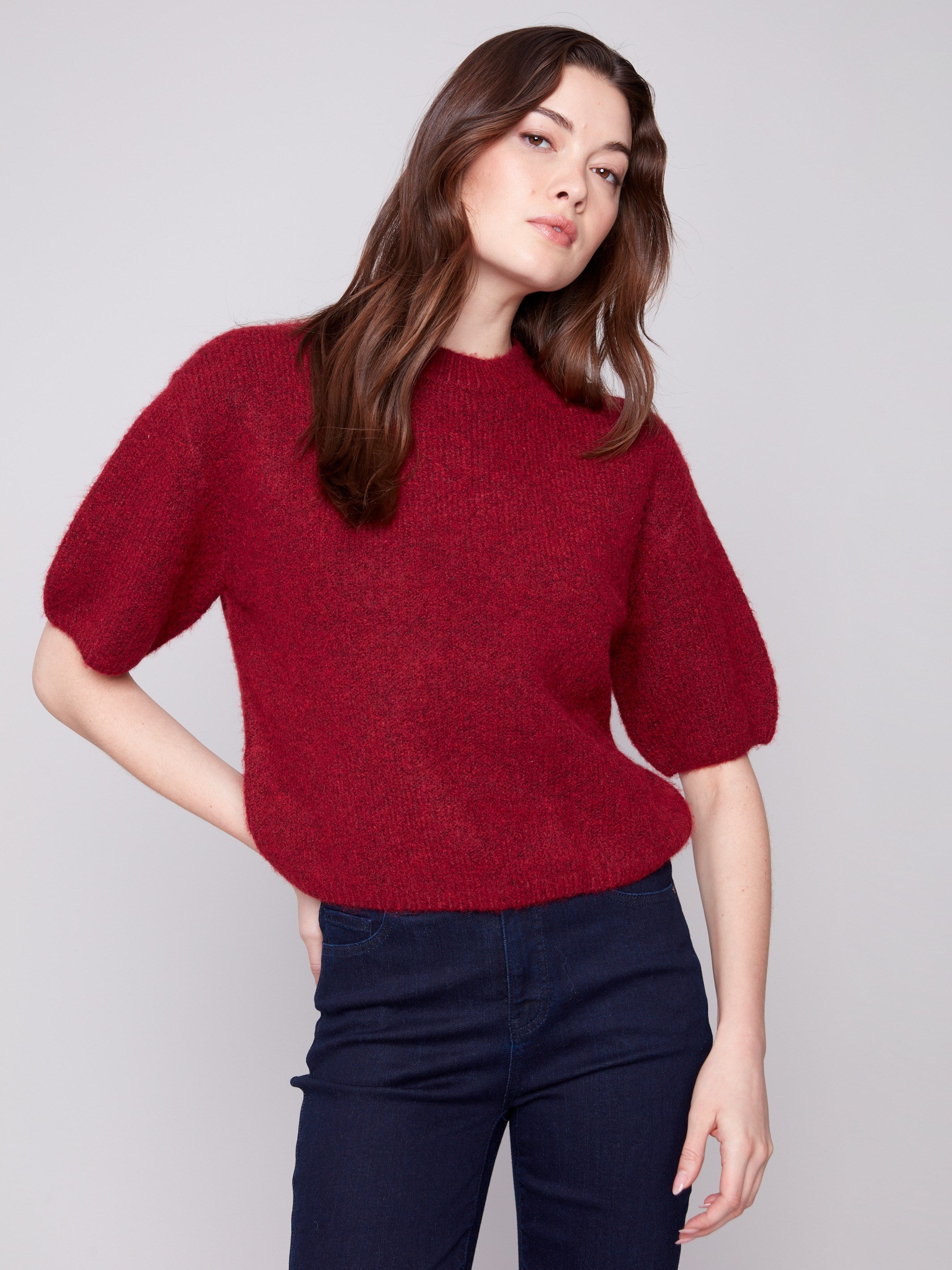This soft-textured Cabernet sweater offers a relaxed fit with charming balloon sleeves by Charlie B.