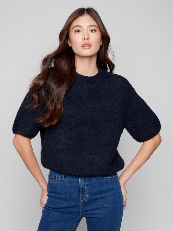 This relaxed fit Moonlight sweater offers a comfortable style with its soft texture and unique design by Charlie B.