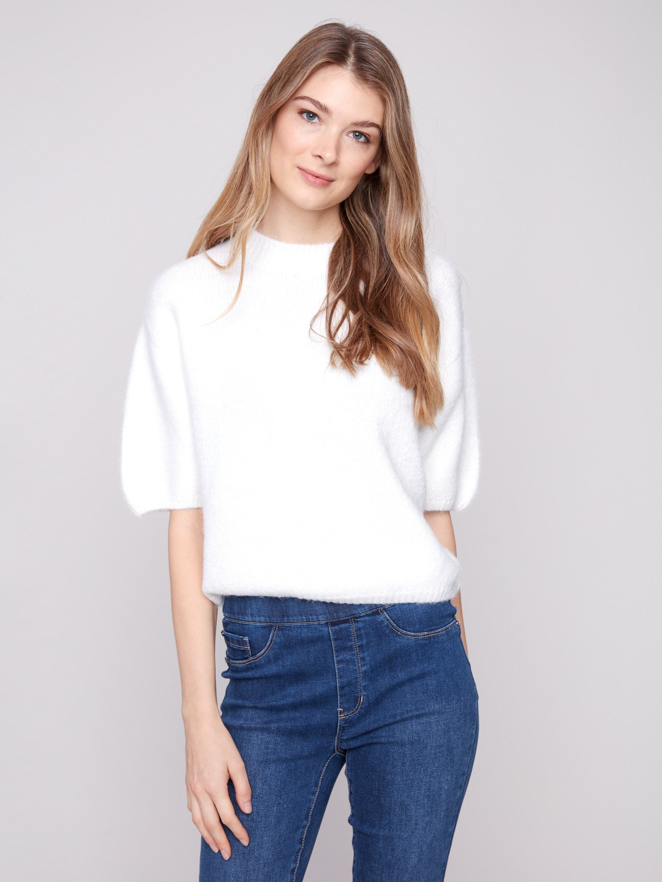 Ecru knit sweater featuring a plush knit texture and soft feel, perfect for cozy days by Charlie B.