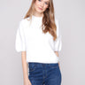 Ecru knit sweater featuring a plush knit texture and soft feel, perfect for cozy days by Charlie B.
