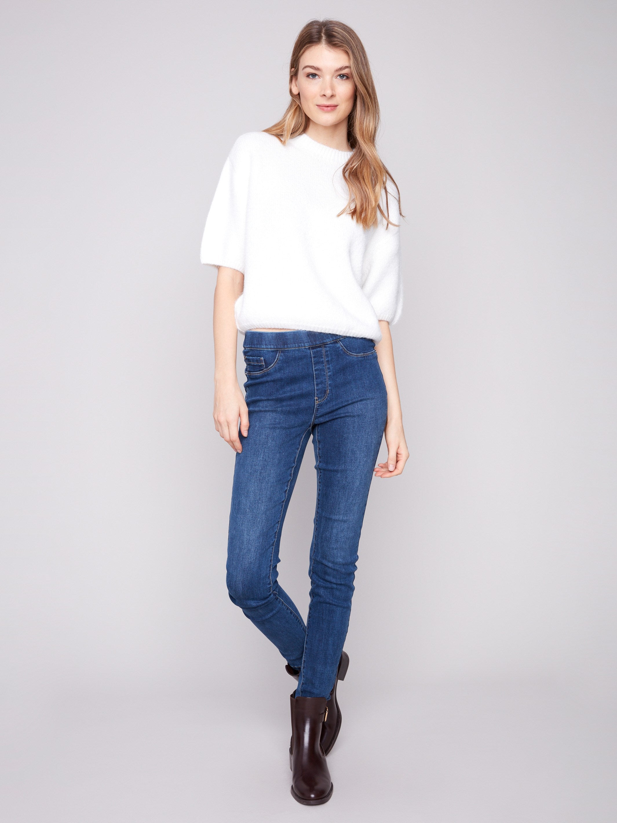 Stylish ecru sweater with balloon-shaped elbow sleeves, offering a chic and modern look by Charlie B.