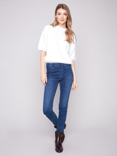 Stylish ecru sweater with balloon-shaped elbow sleeves, offering a chic and modern look by Charlie B.