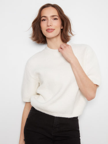 Elegant balloon elbow sleeves add a touch of sophistication to this cozy sweater, making it ideal for any occasion by Charlie B.