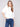 Elegant ecru knit sweater showcasing a crew neckline, ideal for layering in cooler weather by Charlie B.