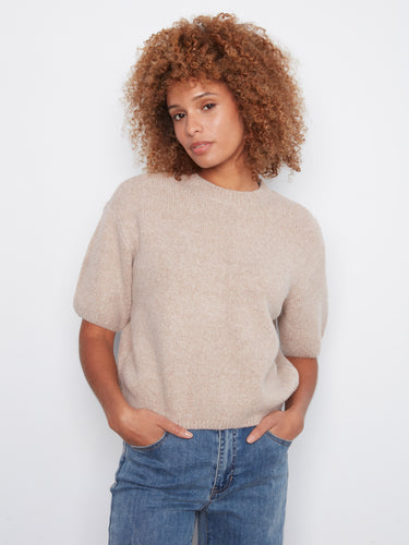 Cozy sweater in soft brushed knit, featuring a stylish mock neck for added elegance. Perfect for cool weather. By Charlie B.