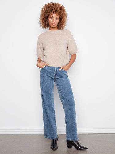 Chic balloon elbow sleeves add a playful touch to this relaxed fit sweater, making it a versatile wardrobe staple. By Charlie B.
