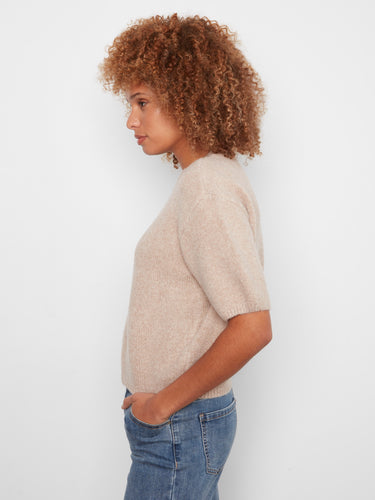 This soft brushed knit sweater features unique balloon elbow sleeves, blending comfort with contemporary style. By Charlie B.