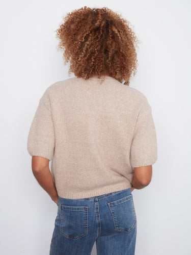 A versatile addition to any closet, this relaxed fit sweater combines a mock neck design with cozy materials. By Charlie B.