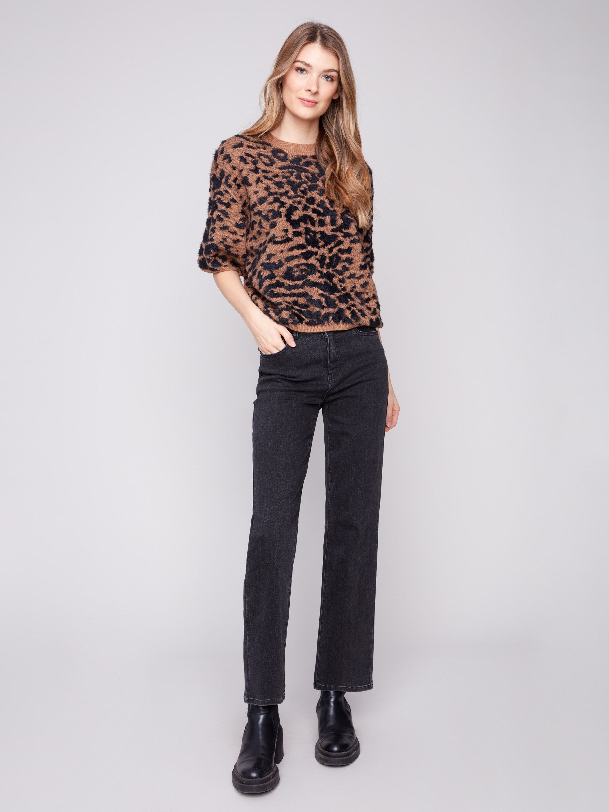 Stylish leopard knit with balloon-shaped elbow sleeves adds a trendy touch to any outfit by Charlie B.